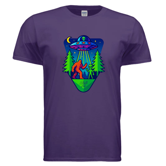 Bigfoot  with an alien under a UFO beam in a neon forest – Skulls Tees graphic design.