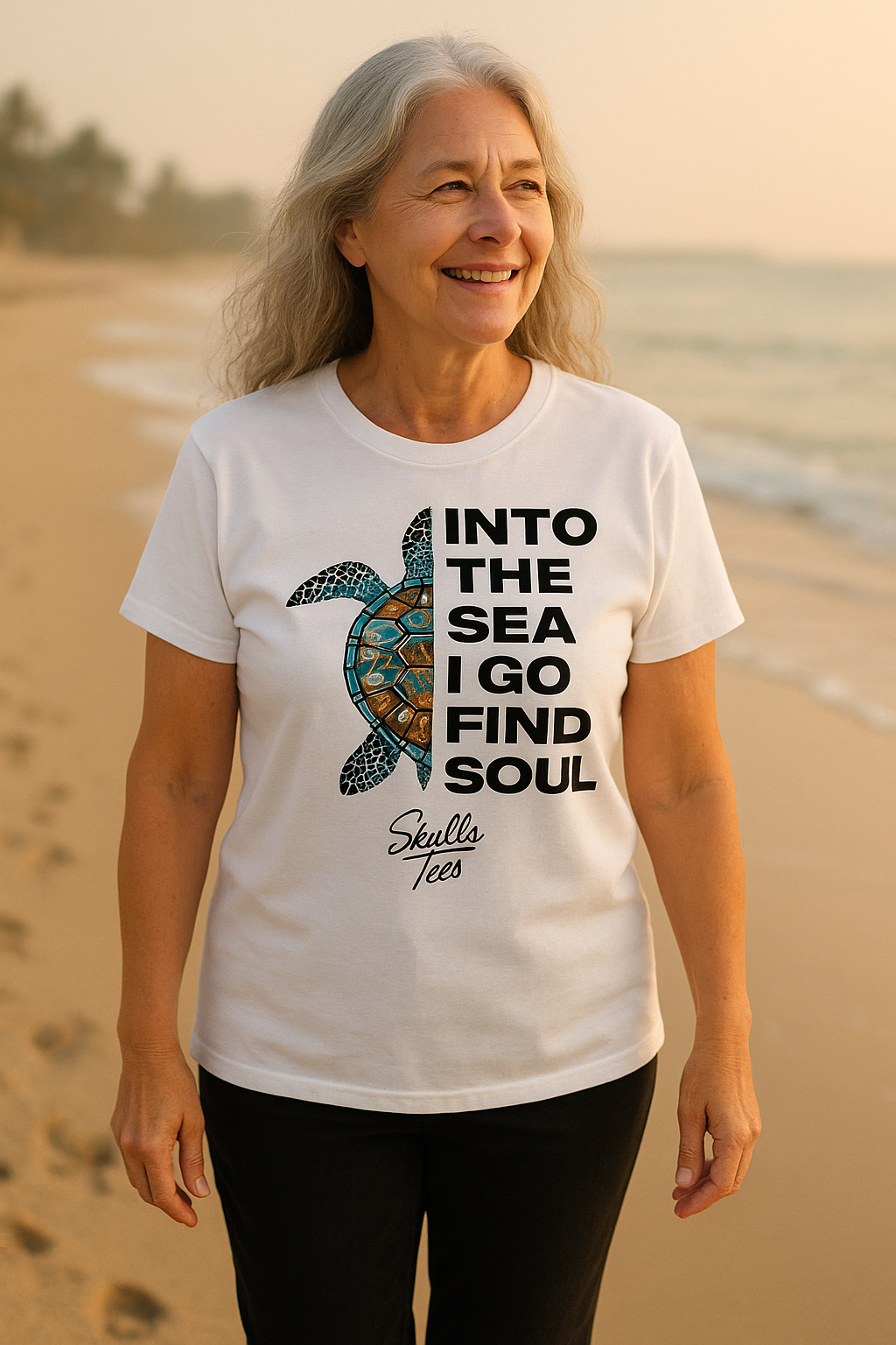 Woman wearing a t-shirt with a turtle graphic and text on a beach
